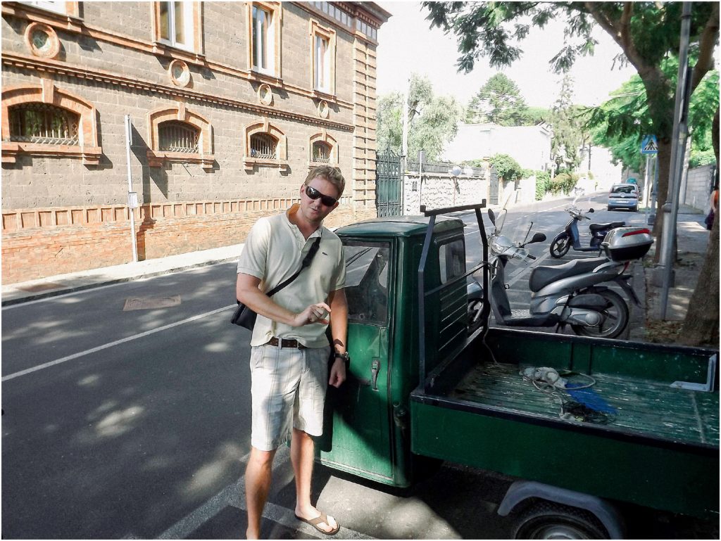 guy in front of an italian truck