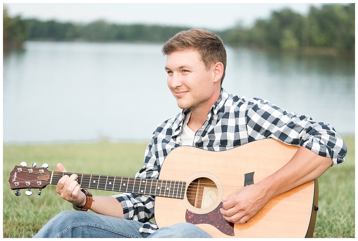 man playing guitar at engagement session